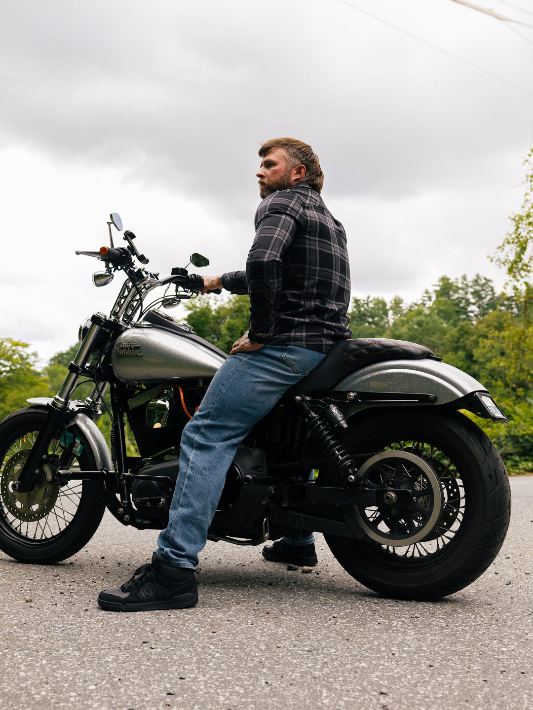 Black Urban Recon 1 shoe being worn on a motorcycle 