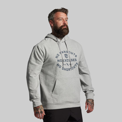 Man wearing a gray hoodie with text on a plain background