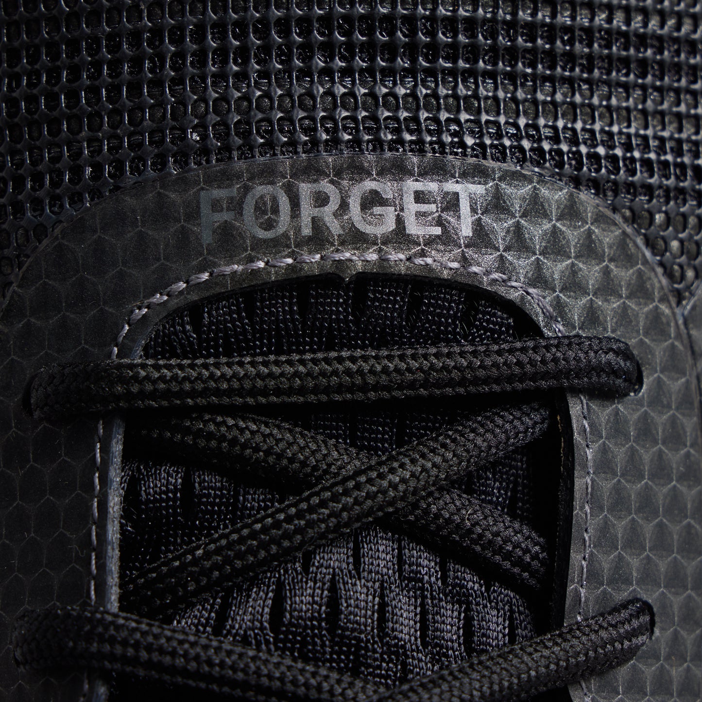 Women's 9/11 Savage 1 training shoe close-up with FORGET top-panel detail