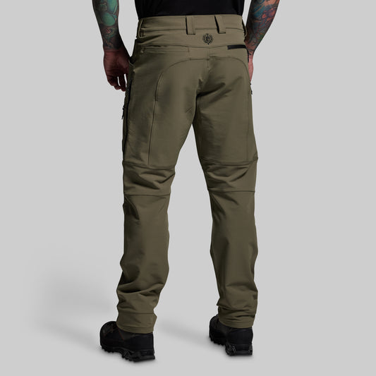 Olive green pants worn by a person on a light gray background