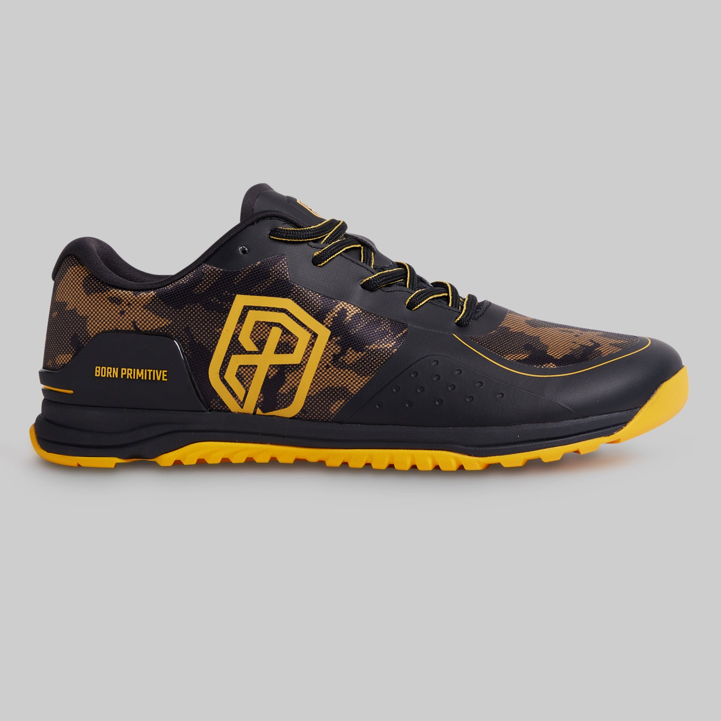 Black and yellow athletic shoe on a gray background