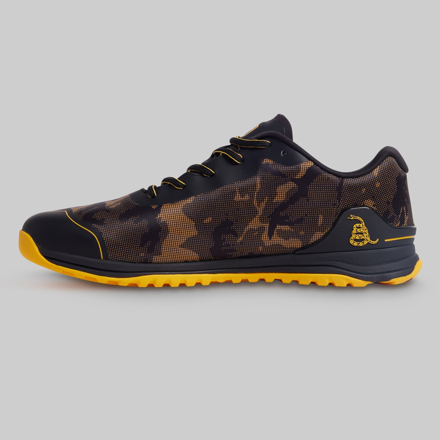 Black and yellow sneaker on a gray background
