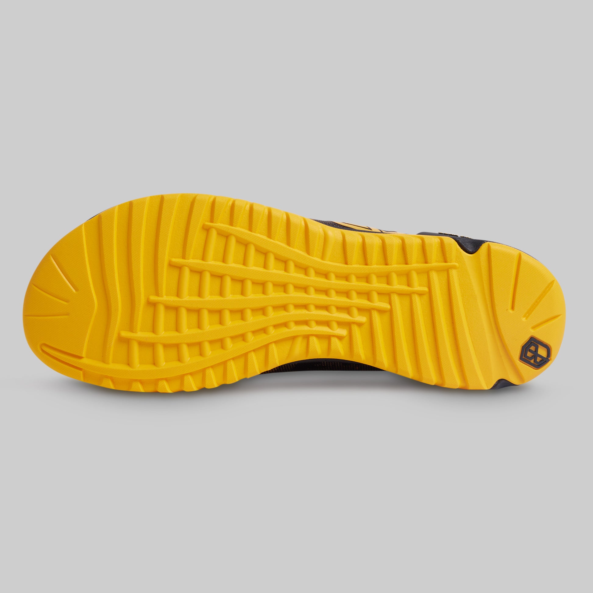 Close-up of a yellow shoe sole on a gray background