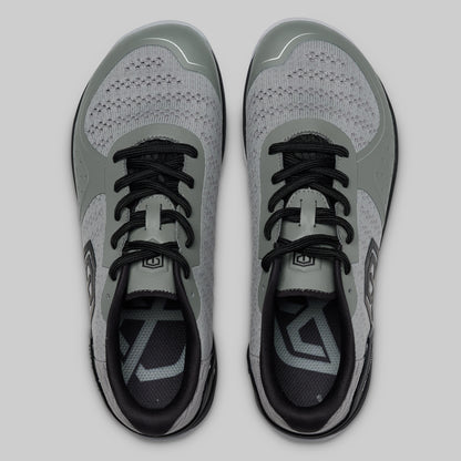 Pair of gray and black athletic shoes on a light gray background