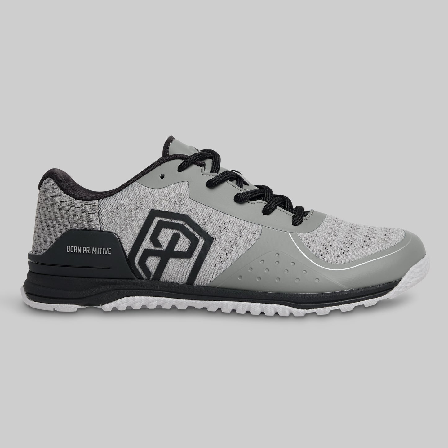 Gray athletic shoe with black accents on a light gray background
