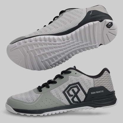 Gray athletic shoes with black accents on a light gray background