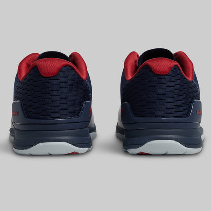 Navy and red athletic shoes on a light gray background
