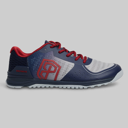 Navy and red athletic shoe on a gray background
