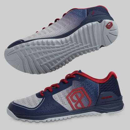 Navy and gray athletic shoes with red accents on a light gray background