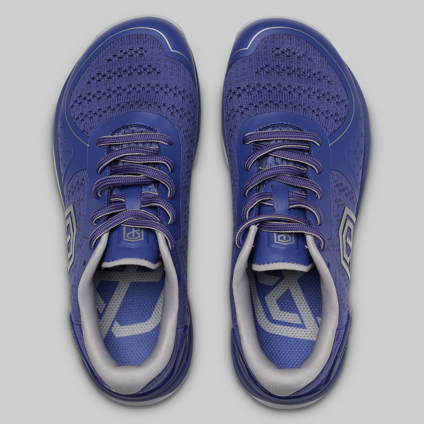 Pair of blue athletic shoes on a light gray background