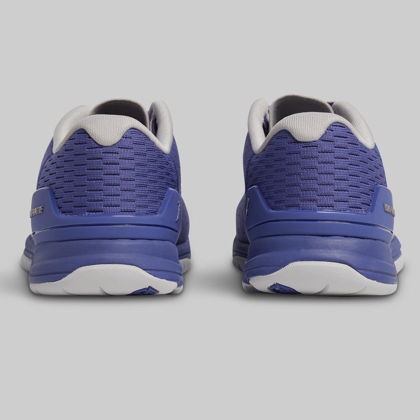 Pair of blue athletic shoes on a gray background