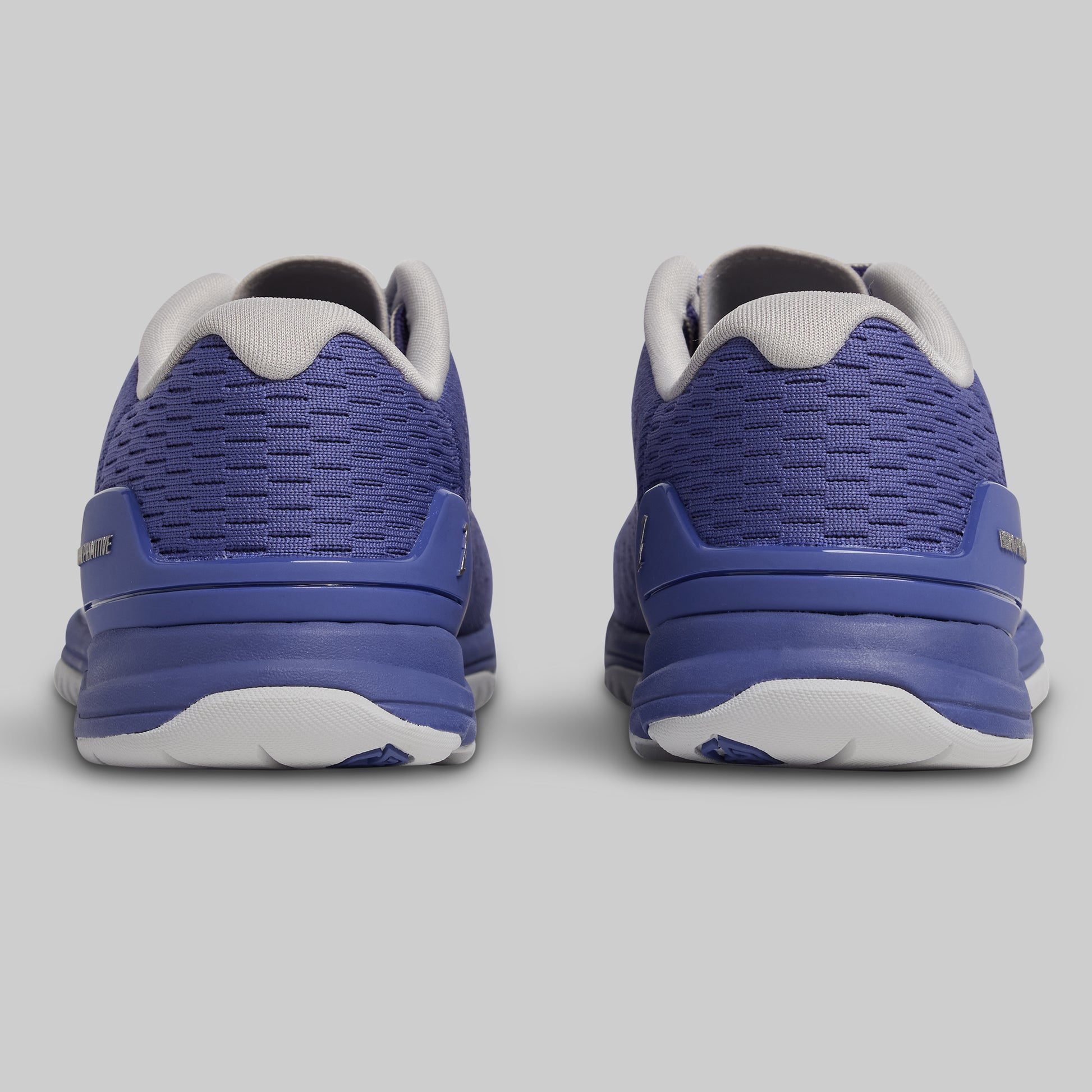 Pair of blue athletic shoes on a gray background