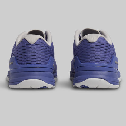 Pair of blue athletic shoes on a gray background