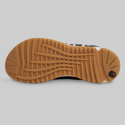 Brown sole of a shoe on a gray background