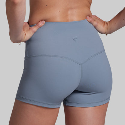 Gray athletic shorts worn by a person on a plain background