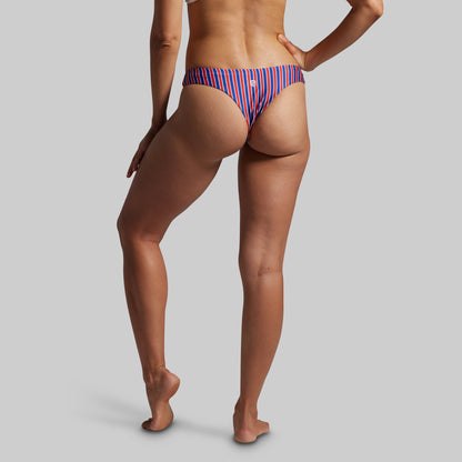 Person wearing a striped bikini bottom on a plain background