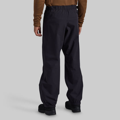 Man wearing black Mission FLEX Rain Pant 2.0, back view