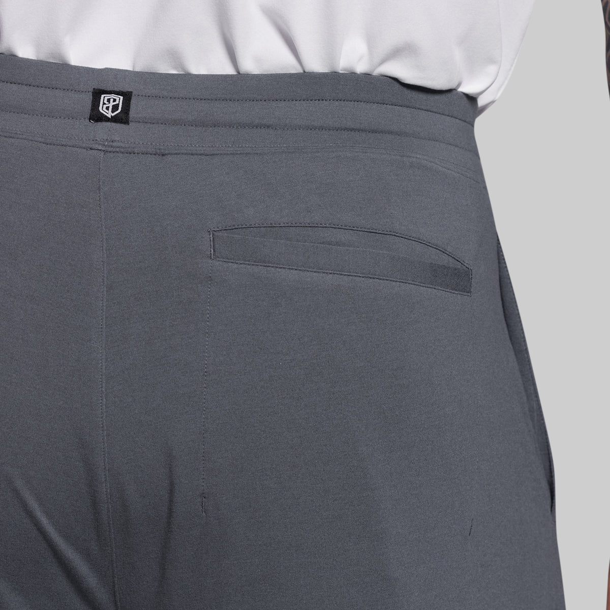 Gray shorts with a pocket detail on a light gray background