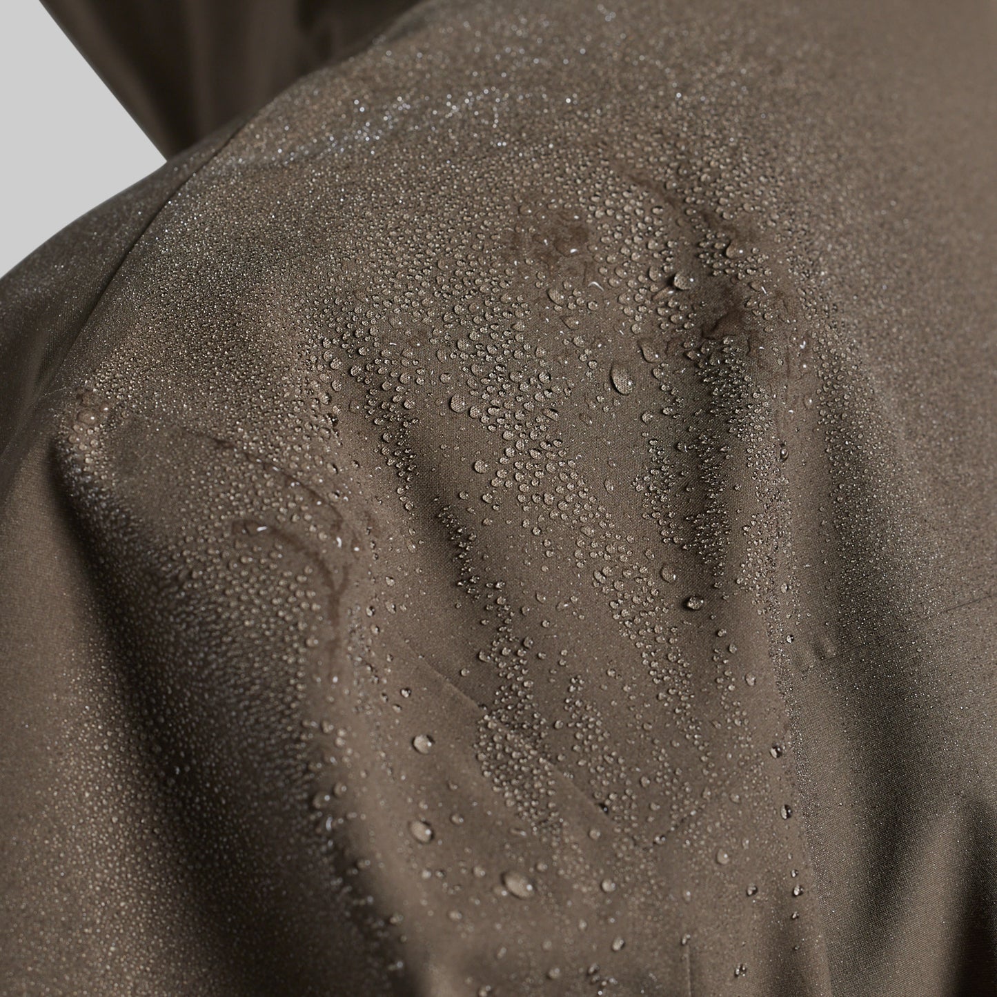 Water beading on the shoulder of the Ranger Green Mission FLEX Rain Jacket 2.0