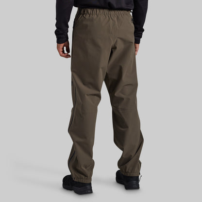 Man wearing Ranger Green Mission FLEX Rain Pant 2.0, back view