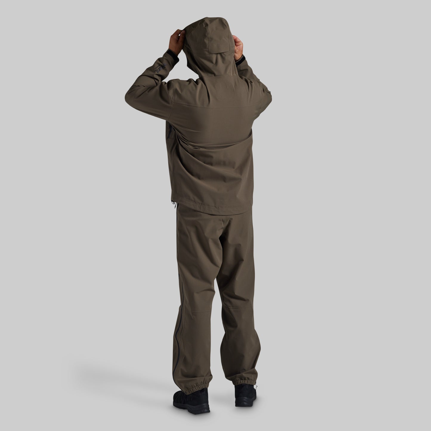 Rear view of Ranger Green Mission FLEX Rain Pant 2.0 with matching jacket