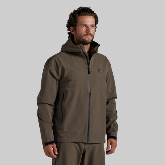 Man wearing the Ranger Green Mission FLEX Rain Jacket 2.0, front view with hood down