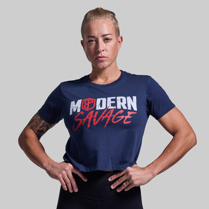 Person wearing a navy blue t-shirt with 'Modern Savage' text on a gray background