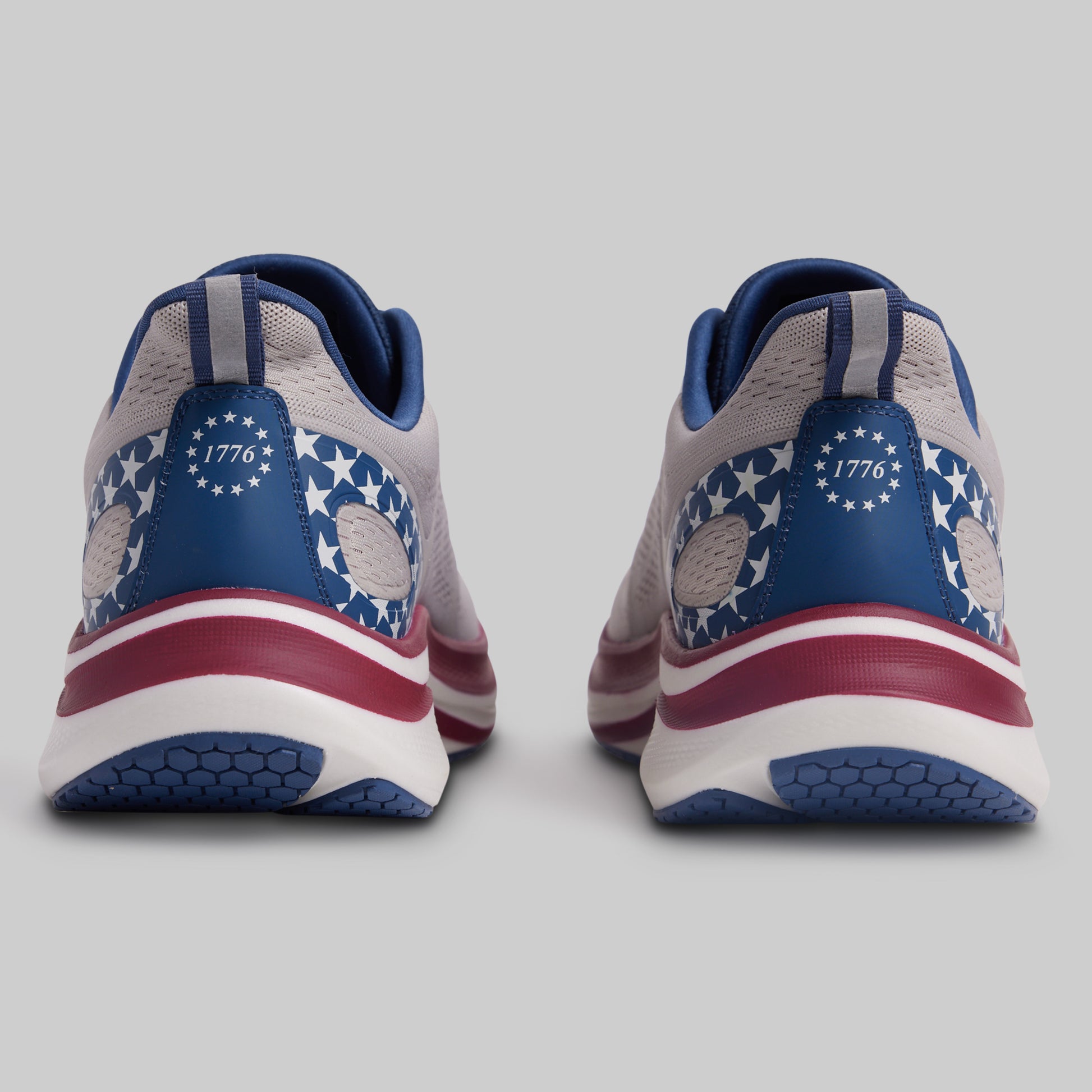 Pair of sneakers with American flag design on a gray background