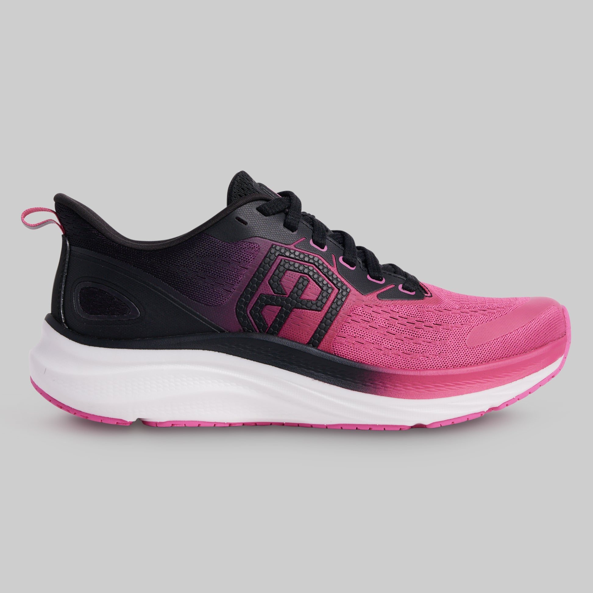 Pink and black running shoe on a gray background