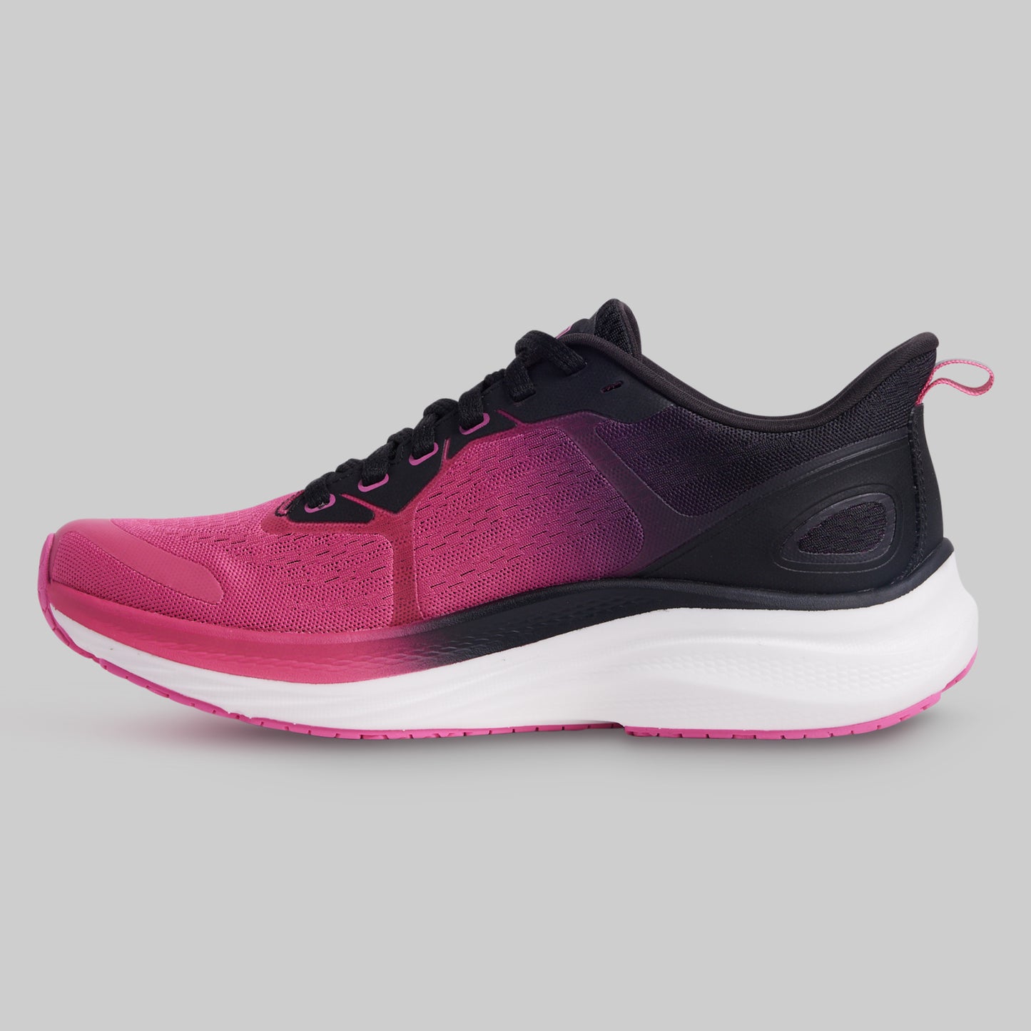 Pink and black running shoe on a gray background