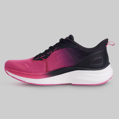 Pink and black running shoe on a gray background