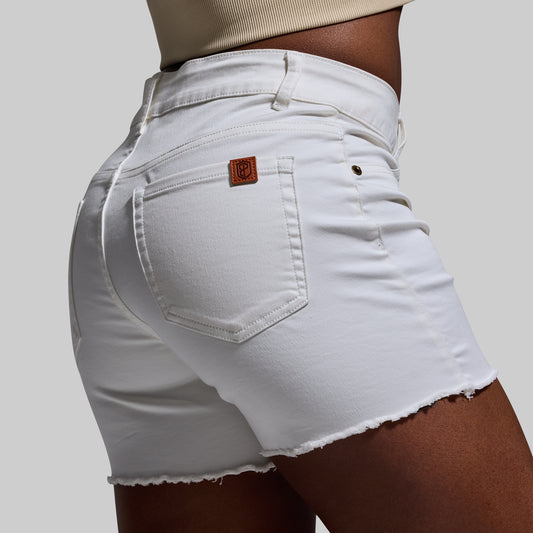 White denim shorts with a brand logo on a plain background