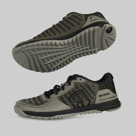 A pair of cross training shoes in tactical green and black color, featuring a mesh upper, lace-up closure, and a thick, treaded sole.