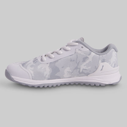 White sneaker with subtle pattern on a light gray background