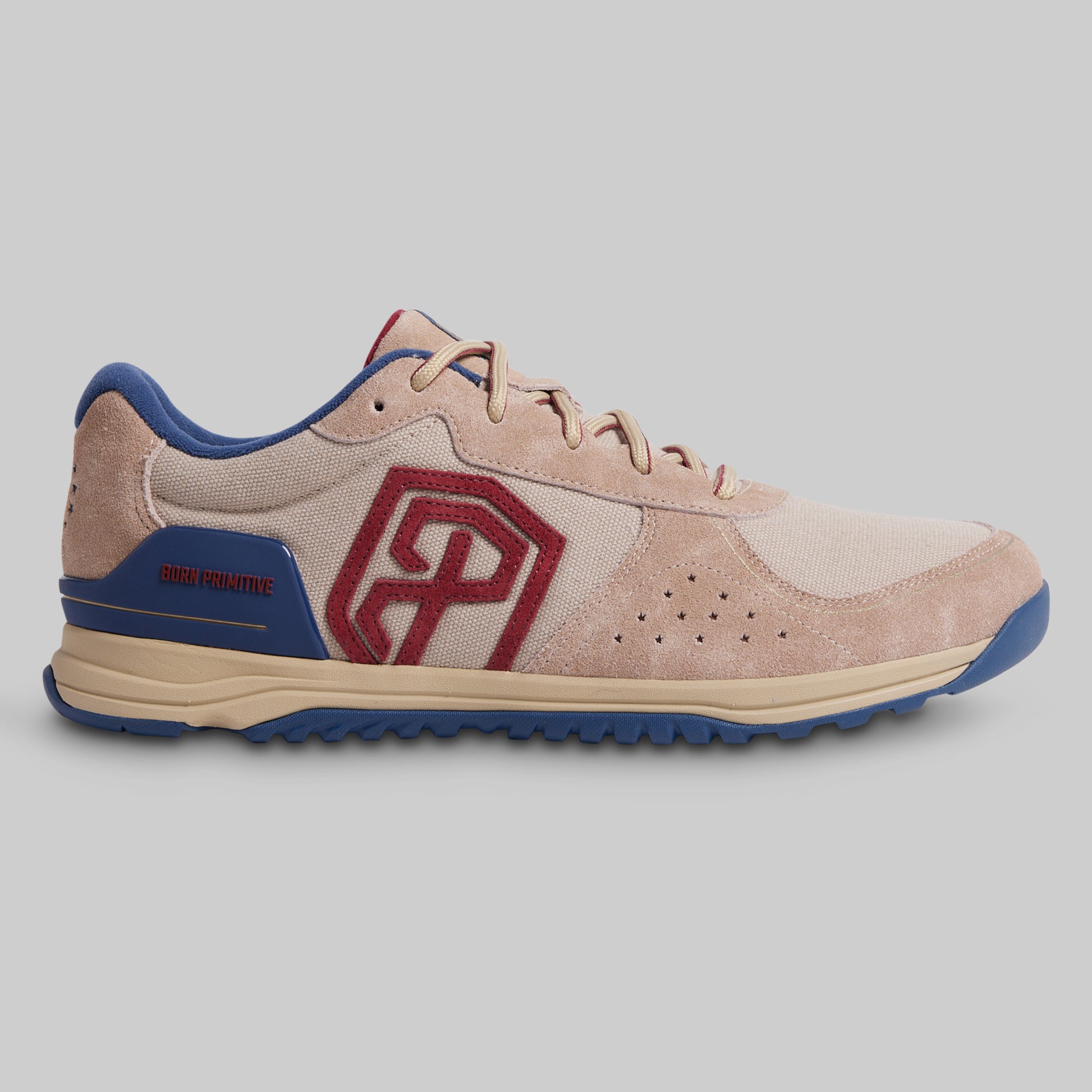 Beige and blue sneaker with a red logo on a gray background
