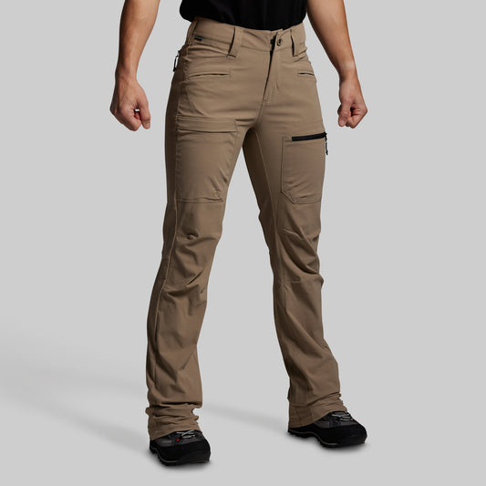 Beige pants worn by a person on a light gray background