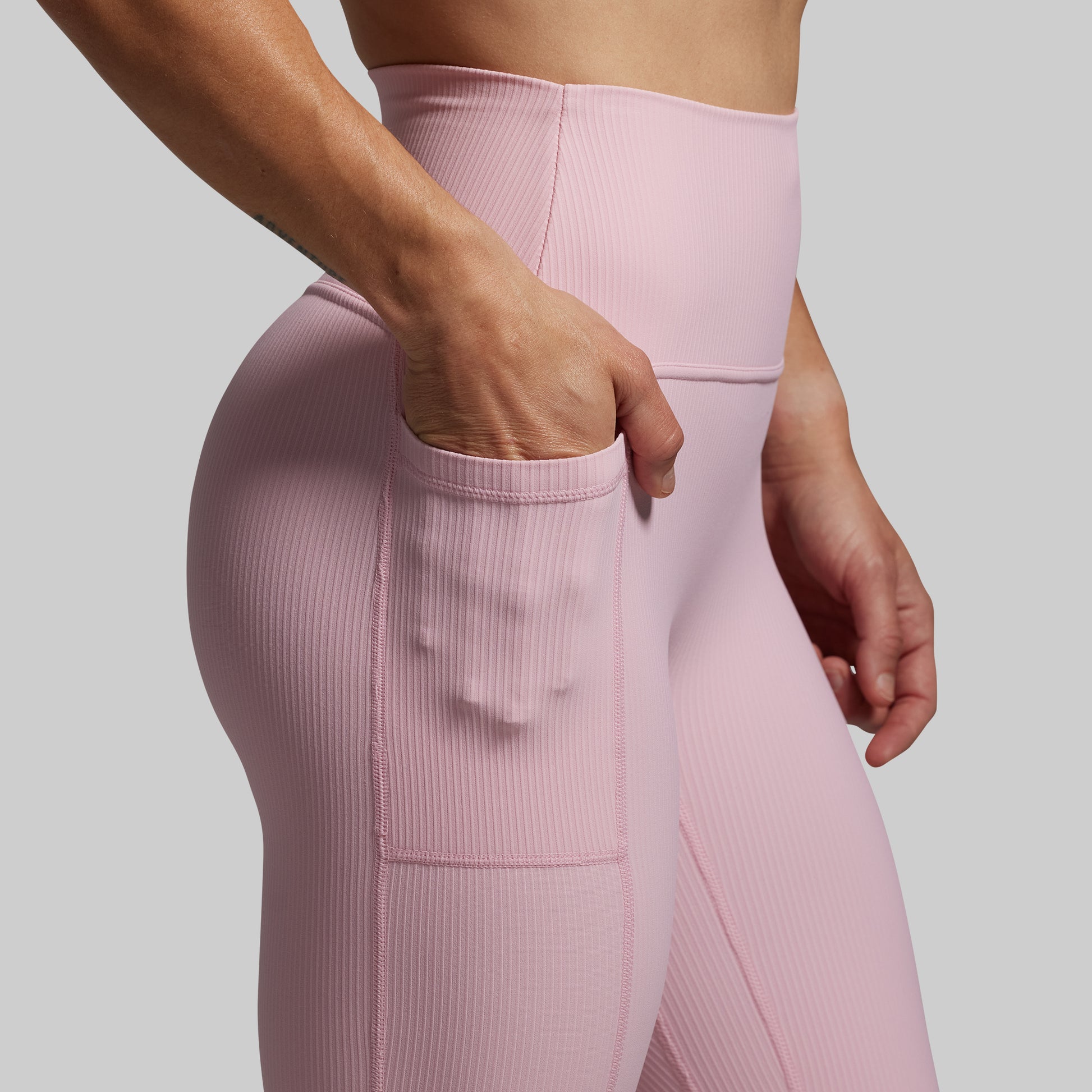 Close-up of pink leggings with a pocket.