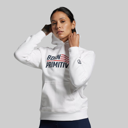 Person wearing a white hoodie with 'Born Primitive' text on a gray background