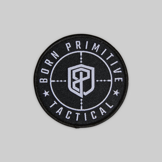Black and white patch with 'Born Primitive Tactical' text on a gray background