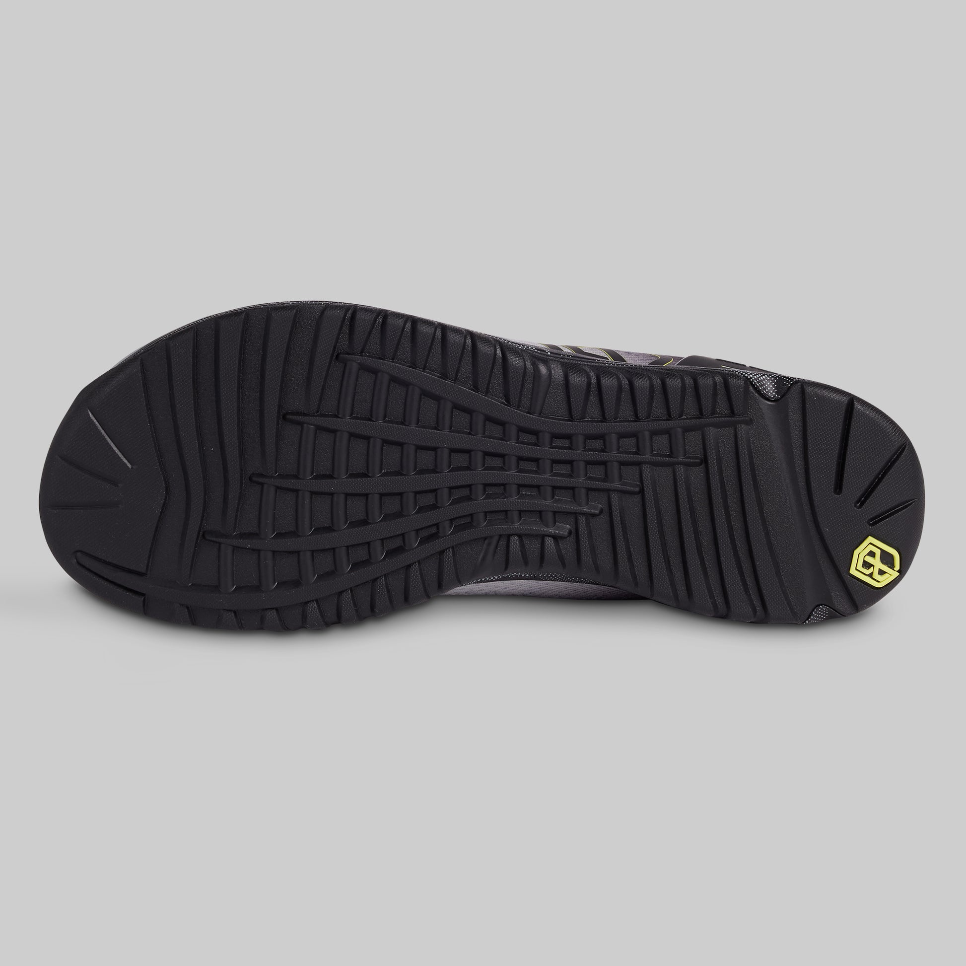Black shoe sole with a brand logo on a gray background