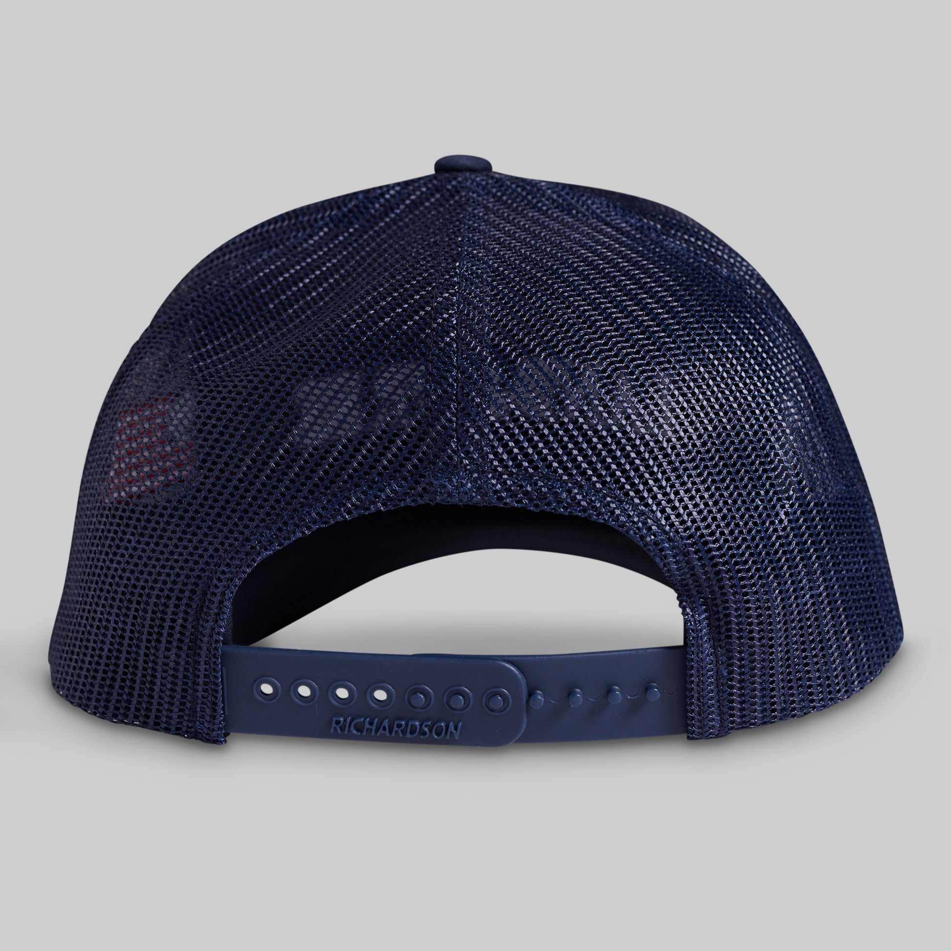 Navy blue mesh cap on a gray background