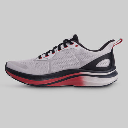 Gray running shoe with black and red accents on a light gray background