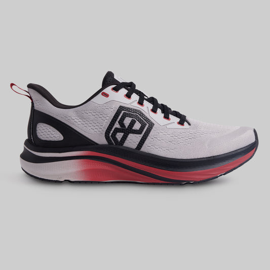 Gray running shoe with black and red accents on a gray background