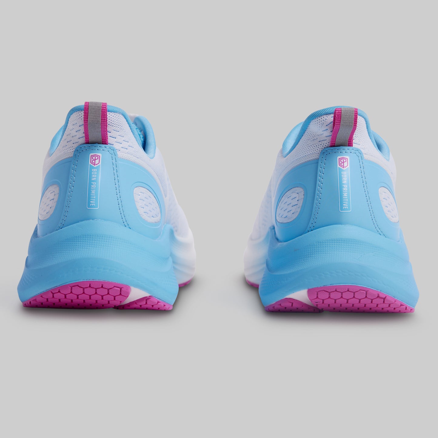 Pair of blue and pink athletic shoes on a gray background