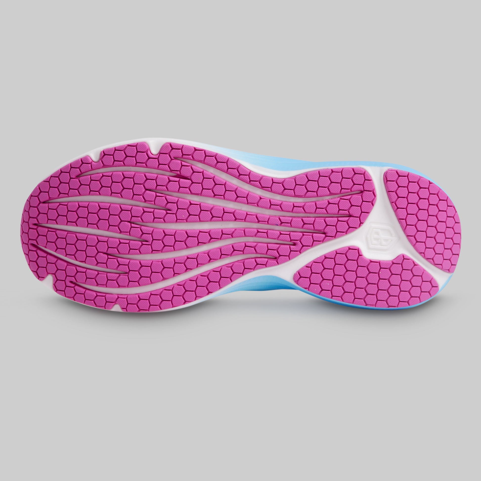 Close-up of a shoe sole with pink tread pattern on a gray background