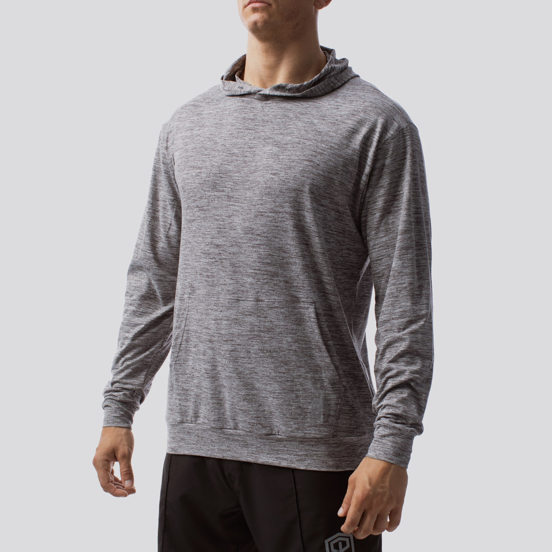 Person wearing a gray hoodie on a light gray background