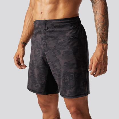 Black camouflage shorts worn by a person on a plain background